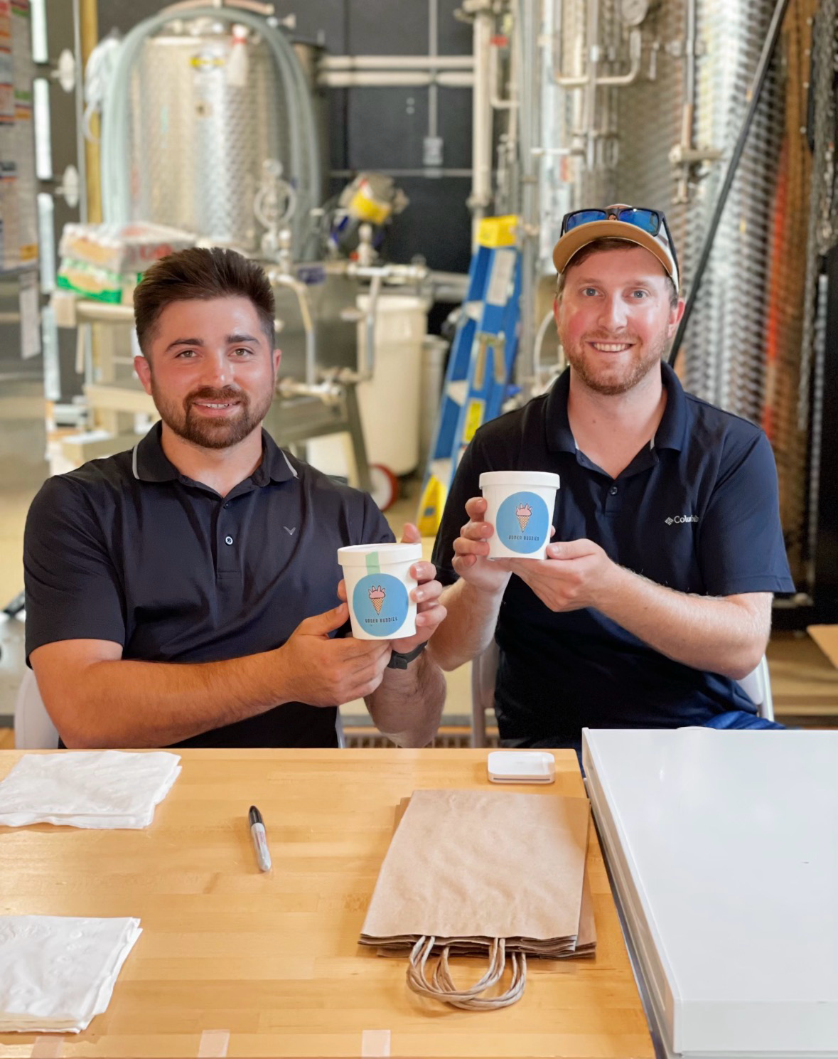 Kevin and Jamieson holding Udder Buddies pints